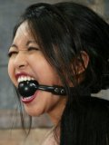 Asian slave Mika Tan gets her body tied, her mouth ball gagged and her tits tortured by Sebastian