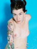 Skinny brunette girl with tattoos Bailey takes off her bikini top and bottom