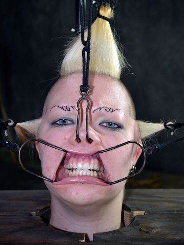 Bondage freak Denali Winter gets tied up and abused in a number of bizarre and brutal ways