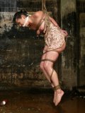 Rope bound suspended asian slave girl Lie Lani gets tortured with high pressure shower