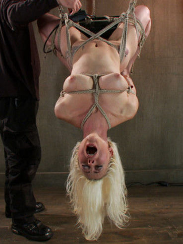 Blonde Lorelei Lee all tied up and lifted up while her bdsm master teased her tits and holes.