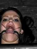Fully nude brunette slave Bobbi Starr gets her mouth, tits and feet tortured.