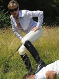 The slave of Lady Sonia can do nothing when she rides and tramples him outdoor