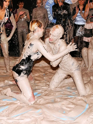 Dionne Darling and Lucy Cornet wrestle in the mud and reveal it all in front of female audience