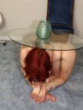 Red haired fetish lover Kayla Jane completely naked and submissive while pretending to be a table.