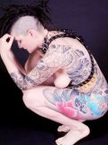 Nude shaved pussy alt lady Michelle Aston demonstrates her tattoos and weird new hairdo