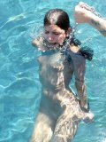 Naked skinny Micah Moore with cuffed hands and ankles gets dunked into the pool