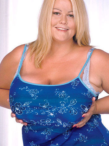 Fat blonde Lou Lou dressed in blue demonstrates her amazing massive tits