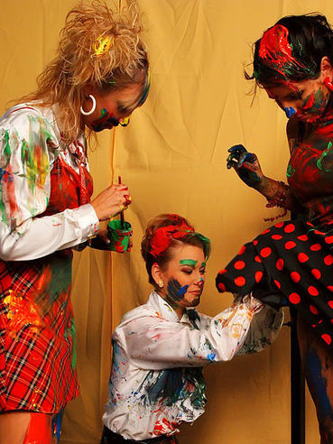 Sonja Beluga and two more ladies paint each others elegant clothes with enthusiasm