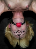 Slave blonde Miss Kitty gets her skinny body stretched between floor and ceiling