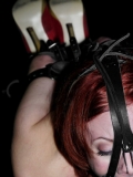 Auburn Sabrina Sparx in gag-mask gets tied up with her heavy high heels on.