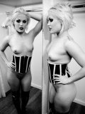 Luscious and sensual blonde Ash Hollywood puts on a hot goth striptease for us