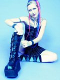 Alternative model Jax in platform boots and skirt displays her pierced pussy