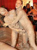 Dionne Darling takes part in public mud wrestling at the all-girl party