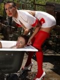Tied up Ella Brawen gets dunked in a bathtub outdoors for the fun of Mandy Bright