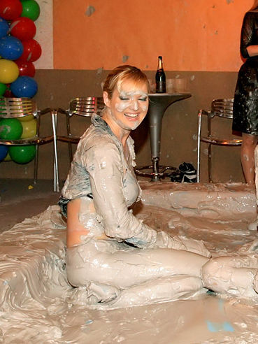 Playful Barbara Summer believes that group wrestling in the mud is such a fun