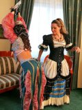 Blonde Gina Killmer and another lady try on luxury costumes and play femdom