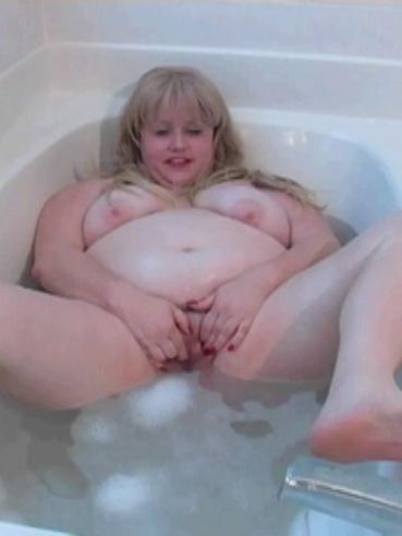 Overweight blonde Harley spreads her pussy and touches herself in the bathtub