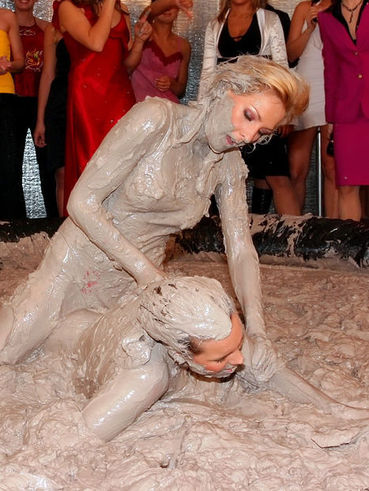 Aggressive party wrestler Lea Casper is covered in sticky mud from to to toe